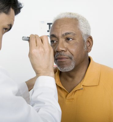 Older African American man having his eyes checked